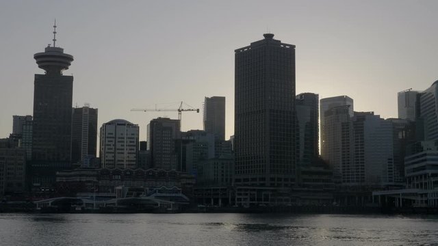 Skyscrapers Of Vancouver, Canada During Sunrise Over The Bay