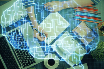 Multi exposure of writing hand on background with brain hologram. Concept of self learning.