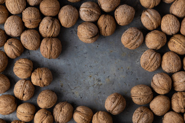 walnuts on a gray metal background