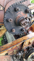 Mechanism. Old gear. Rusty parts. Mechanical device. Old gear with iron gears and pulleys