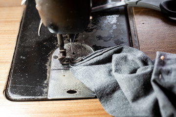 Vintage sewing machine and item of clothing, Close up & Macro shot, Selective focus, Tailor concept