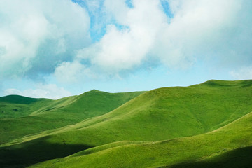 mountain green landscape of mountain slopes on a cloudy summer day