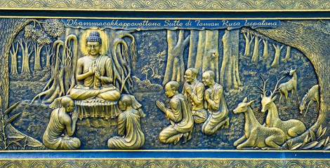 Batu, Indonesia - CIRCA Apr 2020: A golden wall carving in Dhammadipa Arama Temple, in Batu, East...