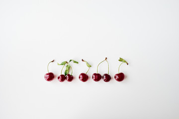 Summer vitamins. Red berries on white background.