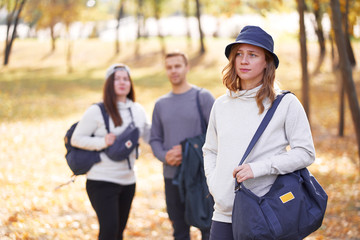 Holidays with friends. Group of young people walking together in the park