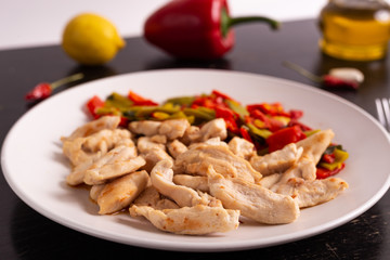Chicken nuggets with lemon and mix vegetables. Low fat protein lunch, fast lunch.