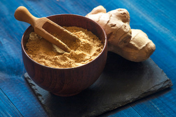 Ginger powder and ginger root. Food photo concept.