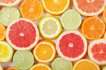 Citrus fruit pattern made of lemon, orange, grapefruit and lime.