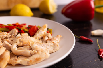 Chicken nuggets with lemon and mix vegetables. Low fat protein lunch, fast lunch.