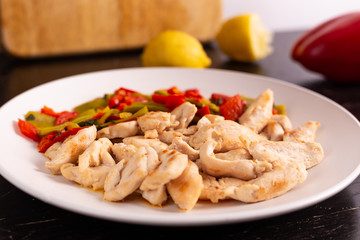 Chicken nuggets with lemon and mix vegetables. Low fat protein lunch, fast lunch.
