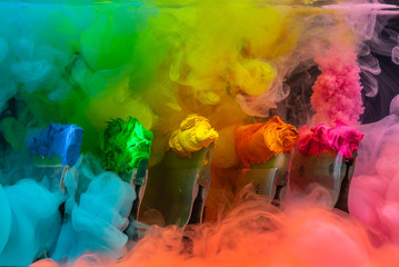blue green yellow orange and pink colors melt in water