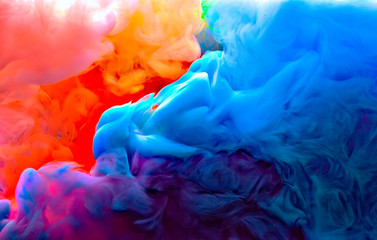 blue green yellow orange and pink colors melt in water