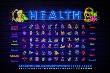 A set of neon light icons on the theme of health. Alternative medicine neon. Yoga . Health care. The outer glow effect. A sign with the alphabet, numbers, and symbols.