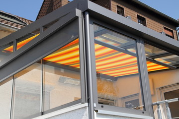 a modern new conservatory with awning