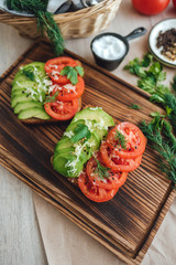 Сup with yellow flowers inside, on a white bed in the morning with notepad and pen. Spring background