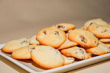 Closeup of cookies with raisins on white background