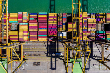 Aerial drone top-down photo of a container port at shipping dock in Valencia, Spain. containers...