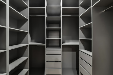 Interior of a modern loft style apartment. Gray wardrobe