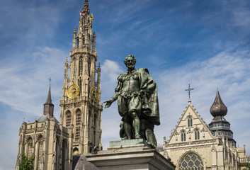 Statue of the Flemish painter Rubens in a square in the Belgian city of Antwerp with the cathedral...