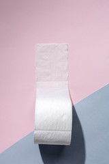 white toilet paper rolls on colored backgrounds