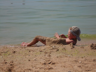 a child on the beach playing