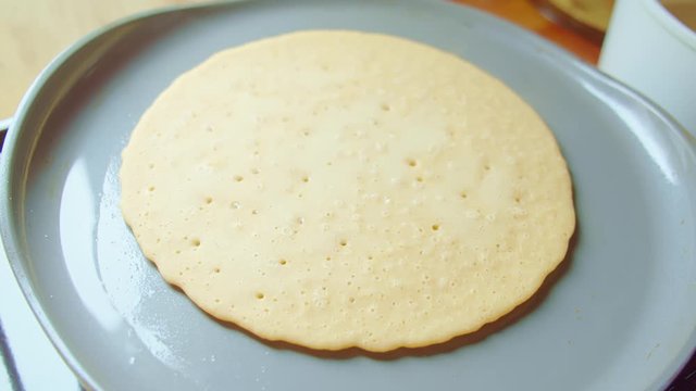 Flapjack, tortilla, pizza, bake pancake fry pan. Kitchen stove, steam, bubbles.