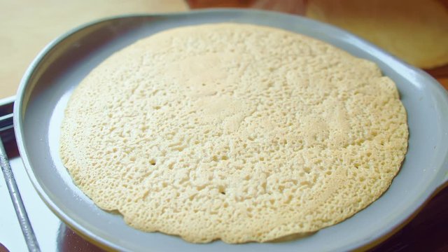Flapjack, tortilla, pizza, bake fry pancake in pan. Steam is coming. Close up.