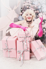 New Year Concept. Attractive pinup woman posing in a Christmas room..