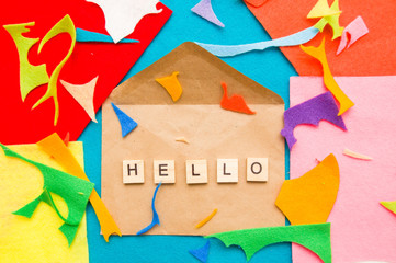 Wooden blocks on colorful background. Piece of felt. Envelope on colorful background. 