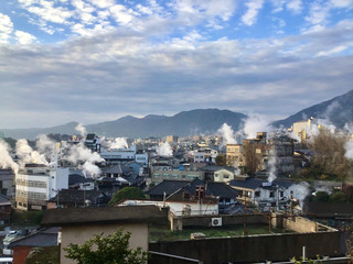 Beppu hot springs with rising steam in Oita