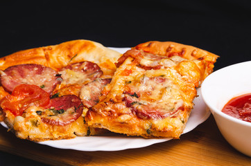 Delicious home made pizza on a white plate