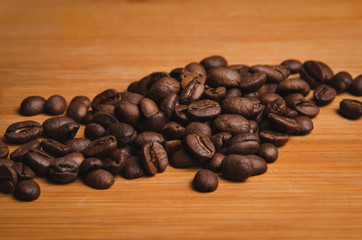 roasted coffee beans on wooden background