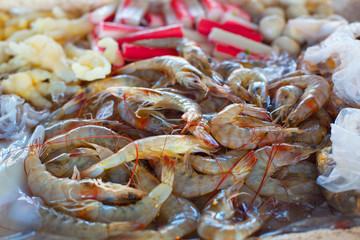 a heap of raw shrimps in a market