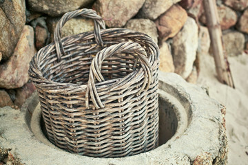 empty wicker basket near stones