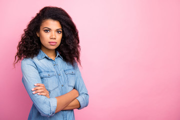Turned photo of serious manager afro american girl cross hands copyspace clever intelligent expert...