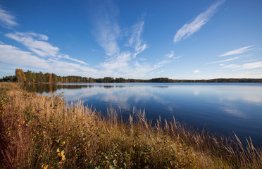 
Blue autumn sky over the lake