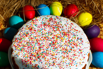 Easter cupcake or Russian Easter cake with beautiful colored decorative topping, Easter still life. Colored eggs. - 336674118