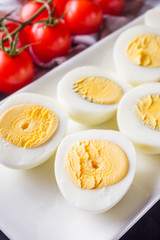 boiled chicken eggs on a dark stone background