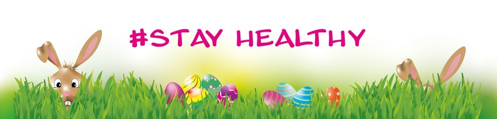 Osterbanner mit Text #stay healthy und zwei Osterhasen in der Wiese mit bunt bemalten Eiern.