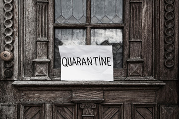 Inscription: Quarantine. Old wooden door. Apocalyptic style (health concept).
