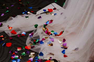 colored confetti on a wedding dress