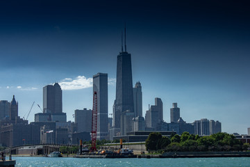 Fototapeta premium Chicago in summer with clear skies with buildings and greenery