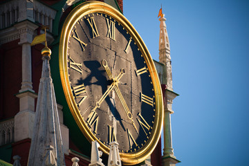 Fototapeta na wymiar Clock on the Spasskaya tower in Moskow, Russia