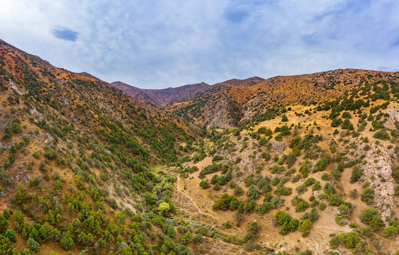 Panorama of the Sairam su gorge in southern Kazakhstan. Sairam Ugam nature Park. Texture background of the foothills of mountains Sairamsu in Central Asia