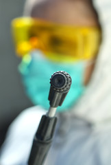 spray gun on the background of the disinfector