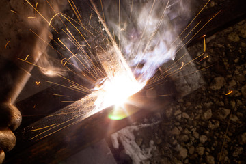 sparks from metal welding at a construction site