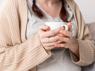 Close-up female enjoying cup of tea