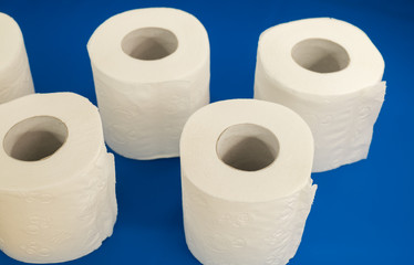 rolls of toilet paper on a blue background
