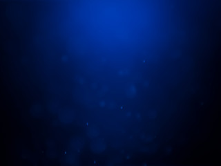 Blue bokeh on a dark background. Blur the background and wallpaper