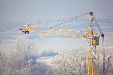 Construction crane working in winter